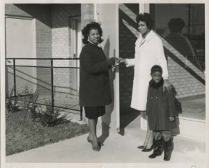 photo of Margarite Syphax and Mother/Daughter, being presented with keys to new home